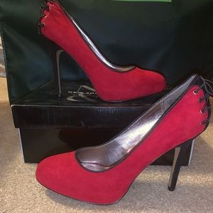 Red and black suede pumps
